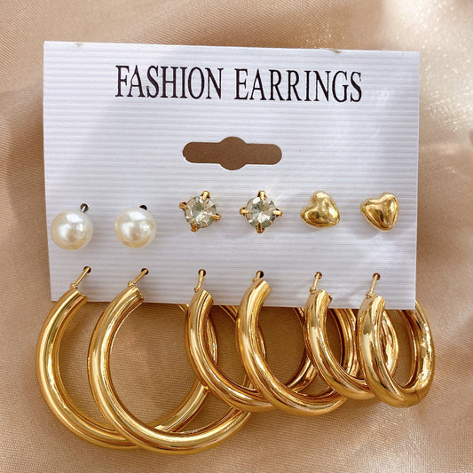 Introducing 17KM's Pearl Twist Hoop Earrings Set: Chic, whimsical, essential.